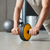Person using AB Exercise Wheel for core strengthening and home workouts on the floor.