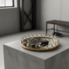 American Round Loop Mirror Tray in Gold - Medium displaying watches and a key on a minimalist table.
