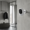 Security Camera 1080P HD Wireless WiFi Rechargeable Battery mounted on a wall in a modern interior.