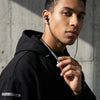 Man wearing Bluetooth Headphones Wireless Neckband Headset, showcasing its stylish design and comfort.