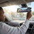 A driver adjusting the view of the 1080P Dual Lens Super Night Vision Dashcam mounted on their vehicle.
