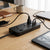 3 in 1 BLD 6USB Port Anti-Static Power Socket on a desk with multiple devices connected.