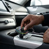 Person using the C15 BT Portable Car MP3 Player in a vehicle interior.