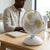8 Inch DC Circulation Fan providing refreshing airflow on a desk for a comfortable workspace.