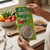 Person holding a package of Stainless Steel Mesh Strainer Filter Spoon with fresh vegetables in background.