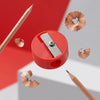 Single-Hole Bulk Plastic Standard Pencil Sharpener with shavings and pencils on a bright background.