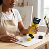 Person dispensing 75ml Acrylic Paint - Yellow Mid onto a palette for painting.