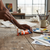 75ml Acrylic Paint - Vermilion being used on a paintbrush with palettes and papers in a bright studio setting.