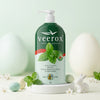 Herbal Camphor Active Moisturising Body Lotion bottle on display with mint leaves and decorative eggs.