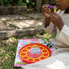 Child using Soap Bubble Maker 170ml to blow bubbles outdoors, surrounded by grass and playing joyfully.