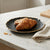 European Vintage Dinner Plate with a croissant and bread on a marble countertop, perfect for elegant dining.