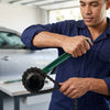 A mechanic using a Double Chain Oil Filter Wrench Tool to remove an oil filter in an automotive workshop.