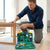 A man using the 37 Piece Multifunctional Power Tool Set to work on a piece of furniture.