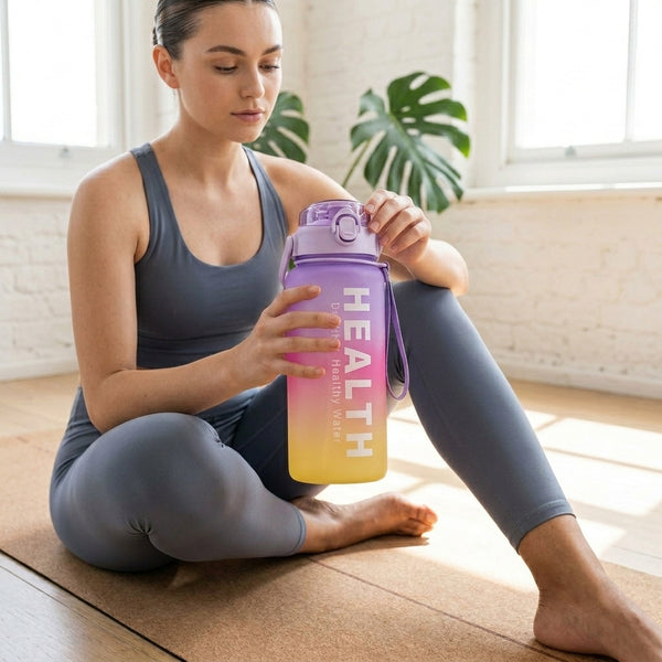 Woman holding a 4-in-1 Motivational Gradient Water Bottle Set during yoga workout.