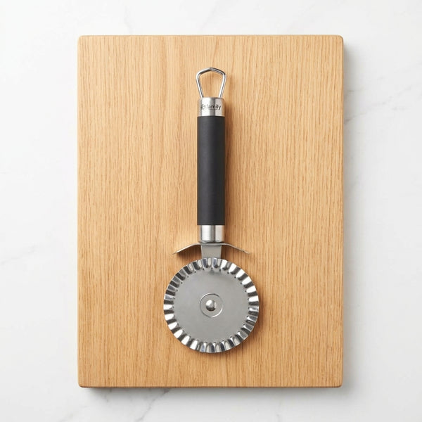 Eco-Friendly Kitchen Pizza Cutter on a wooden board, designed for efficient and organized cooking.