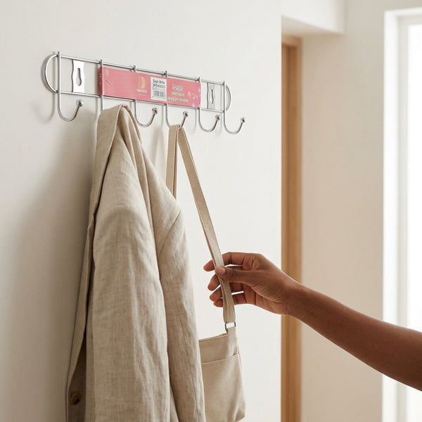 Chrome Plated 8-Hook Wall Mounted Rail holding a coat and bag on hooks in a modern entryway.
