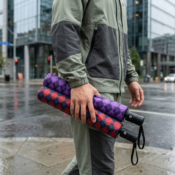 Man holding two Auto Open 3-Folding Portable Umbrellas in a city during rain.