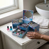Childrens Handmade Plastic Crystal Gem Toy Set displayed with colorful makeup products and a hand reaching for the boxes.