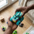 Colorful Plastic Four Wheel Drive Double-Sided Stunt Car held in hands, showcasing its vibrant design and durability.