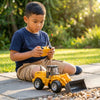 Boy playing with Kids Engineering Bulldozer Toy with Rolling Wheels in outdoor setting.