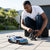 Person controlling a Scale RC Drift Car 4WD High Speed on a driveway.