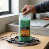 Green Polyamide 6.6 Nylon Cable Ties package being held with bundled cables, ideal for secure cable management.