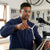 Man using a Professional Y-Type Socket Wrench to repair a bicycle in a workshop.