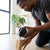 A person installing Universal Silent Swivel Luggage Replacement Wheels on a wooden base for repair.