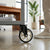 Single Swivel Shopping Cart Caster Wheel shown on a cart in a modern workspace, providing smooth mobility.