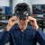 Man wearing the German Style Auto Darkening Welding Helmet in a workshop setting.