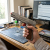 1911 Shell Ejecting Soft Bullet Toy Gun in hand, showcasing realistic design for outdoor play and target practice.