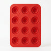 Heart Shape Silicone Baking Mold in red with 12 swirl-shaped cavities for elegant desserts.