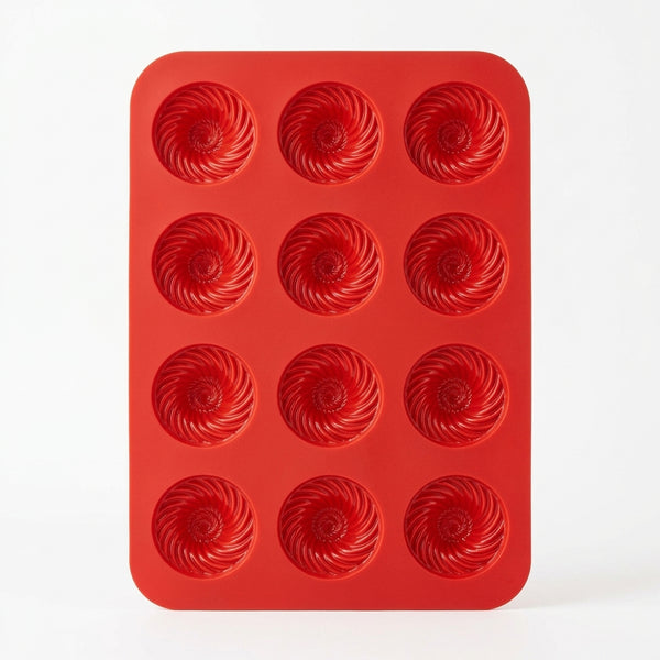 Heart Shape Silicone Baking Mold in red with 12 swirl-shaped cavities for elegant desserts.
