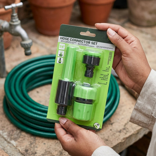 4pcs Connector Set packaging held by hands with a green hose in background for connecting garden hoses.