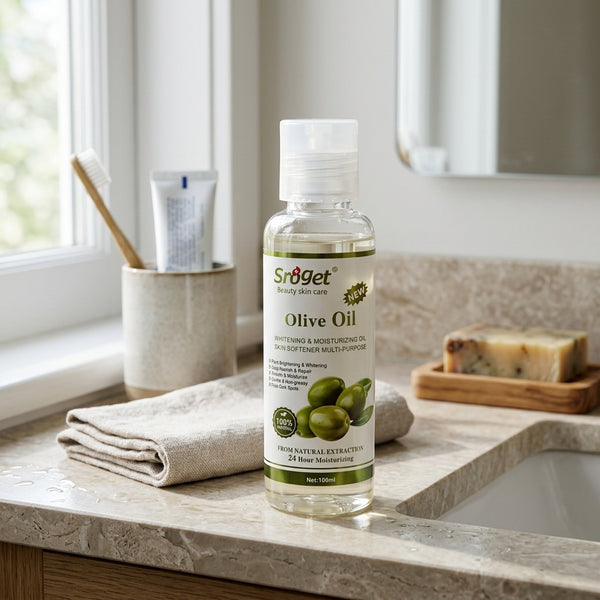 Natural Extract Moisturizing Olive Oil bottle on a bathroom countertop with towels and soap.