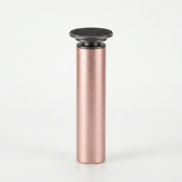 Electric Callus Remover Foot File with Sanding Disc in sleek pink design for smooth heels at home.