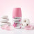 Antiperspirant Deodorant Cream with pink cap and floral design on a pastel background.