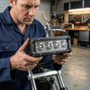 Technician inspecting IP67 Waterproof 36W LED Linear Lighting Fixture in garage environment.