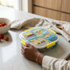 Square 1200ml 3 Compartment Lunch Box with colorful vehicle design and yellow clips, perfect for organized meals.