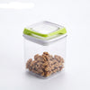 4-Piece Plastic Food Storage Container with Latching Lids holding walnuts for fresh food storage.