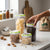 4-Piece Plastic Food Storage Container with Latching Lids organized with various ingredients in a modern kitchen setting.