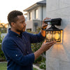 Outdoor Solar Lamp Waterproof Human Induction Light being installed by a man outdoors, showcasing its practical design and functionality.