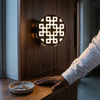 Modern Waterproof LED Outdoor Wall Lamp illuminating a stylish interior wall with a unique geometric design.