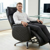Man sitting in an Executive Genuine Leather Reclining Office Chair in a modern office setting.
