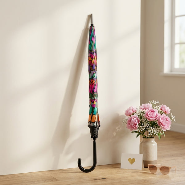 Colorful Patterned Long Handle Umbrella displayed indoors with flowers and sunglasses.