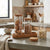 Stackable Borosilicate Glass Storage Jar with Bamboo Lid filled with nuts, displayed on a kitchen countertop.