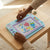 Child using the Kids Electronic LCD Writing and Drawing Tablet to create colorful drawings on a portable device.