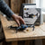 Hands-on with the 998 PRO 4K Dual Camera Foldable Drone on a wooden table with its packaging in the background.