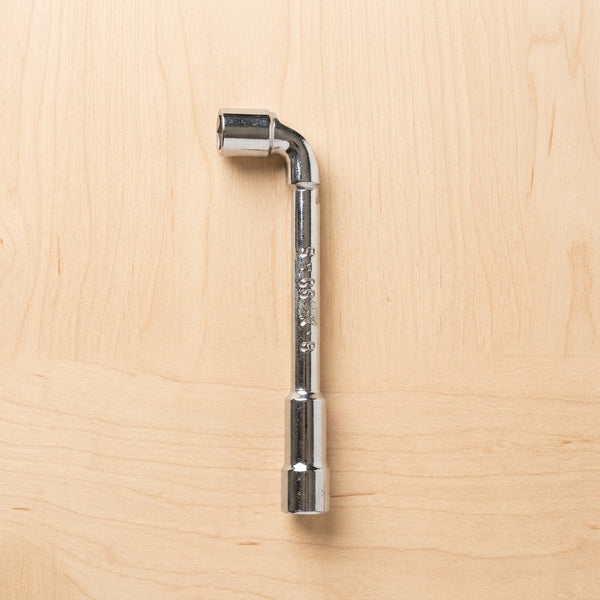 Pipe Socket Wrench L-Shaped tool for automotive repair on a wooden surface.