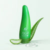 Aloe Vera Soothing Moisture Conditioner bottle with aloe vera leaf and slice, promoting hydration and softness for hair.